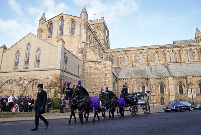 The funeral cortege for Holly Newton leaves Hexham Abbey 