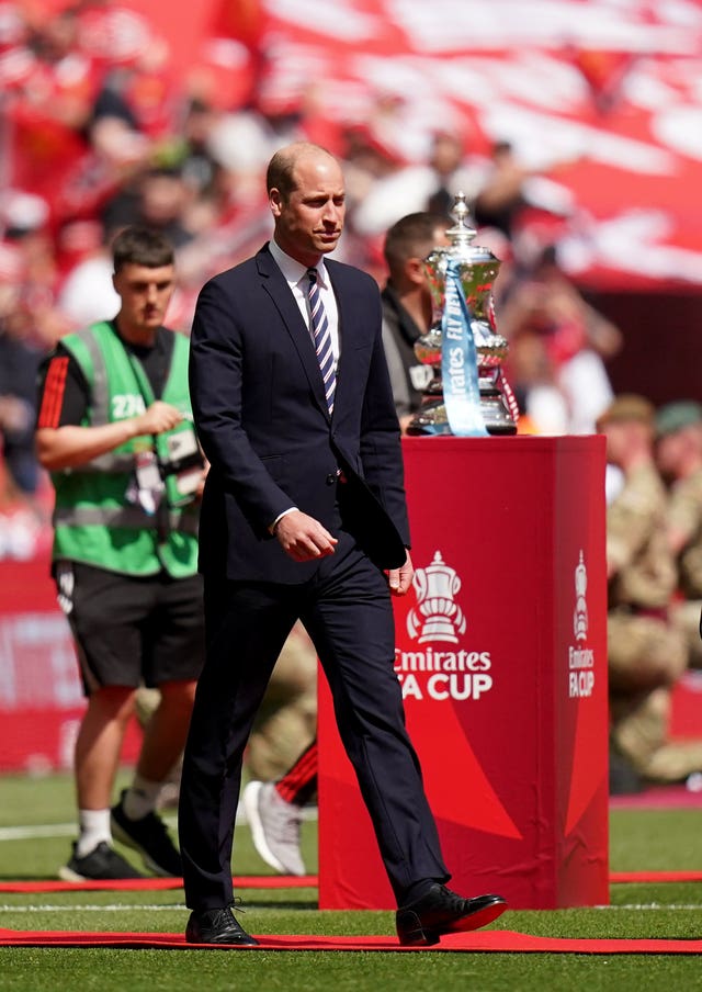 The Prince of Wales makes his way onto the pitch to meet the players before the Emirates FA Cup final at Wembley Stadium in 2023 