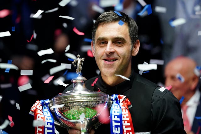 Ronnie O’Sullivan with the World Championship trophy at the Crucible