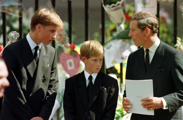 The Prince of Wales, Prince William and Prince Harry wait outside Westminster Abbey for Diana, the Princess of Wales’ coffin to enter the Abbey (Adam Butler/PA)