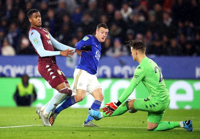 Orjan Nyland saves from Jamie Vardy, centre, in the semi-final first leg