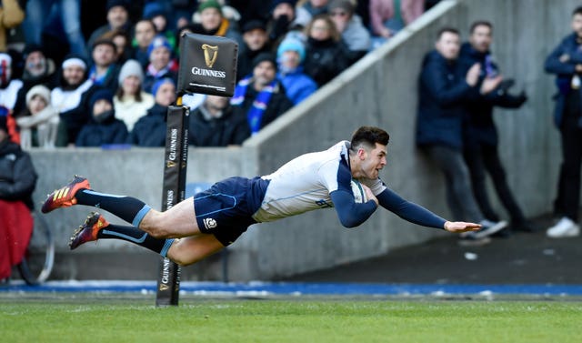 Scotland's Blair Kinghorn dives over for the first time against Italy (Ian Rutherford/PA).