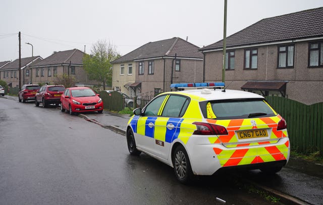 Police at the scene in Pentwyn, Penyrheol, near Caerphilly, where a 10-year-old boy has died following reports of a dog attack (Ben Birchall/PA)