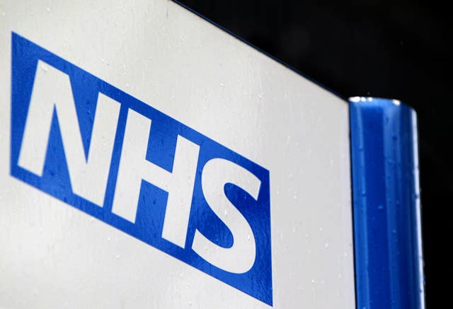 A blue and white NHS sign