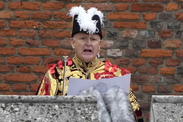 Garter Principle King of Arms, David Vines White reads the proclamation of new King, King Charles III, from the Friary Court balcony 