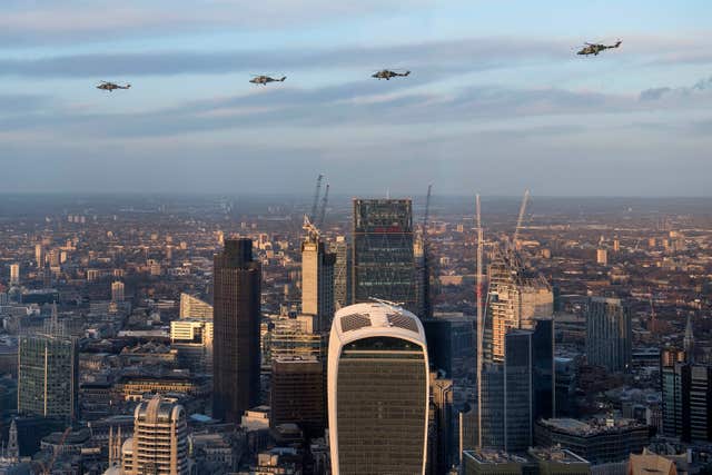 Four Lynx helicopters flying over London (Victoria Jones/PA)