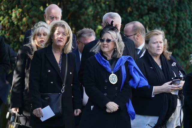 Mourners arrive for the funeral 