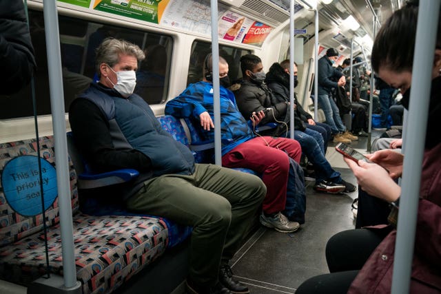 Commuters in London will have to continue to wear face coverings after so-called 'freedom day'