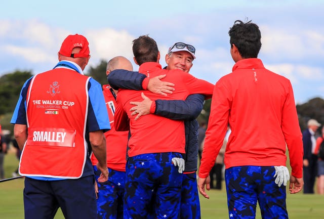 USA captain Nathanial Crosby celebrates with his players after they retained the Walker Cup