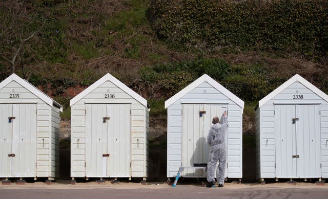 There were quieter scenes on Bournemouth beach on Monday - allowing for a lick of paint on the beach hunts