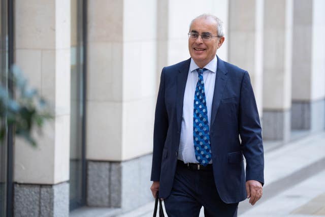 Lord Pannick walking along a street