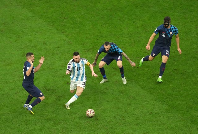 Lionel Messi takes on Croatia’s Mateo Kovacic, Marcelo Brozovic and Josko Gvardiol, l-r