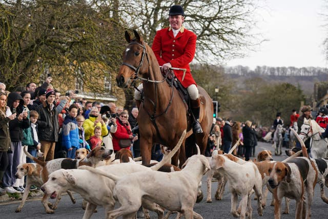 Riders and hounds during the annual North Cotswold Boxing Day hunt in Broadway, Worcestershire