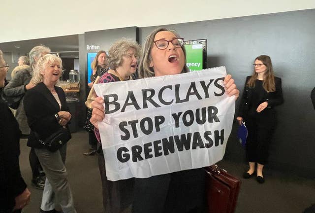 Protesters demonstrating at the Barclays PLC AGM at the QEII Centre in central London