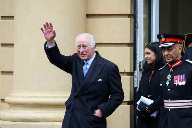 The King waving to well-wishers