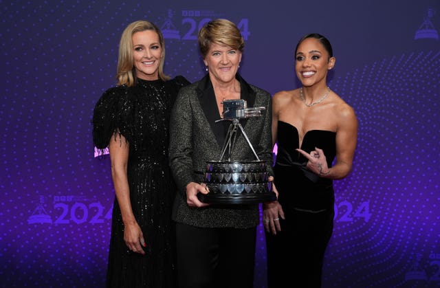 Gabby Logan, Clare Balding and Alex Scott pose with the BBC Sports Personality of the Year trophy