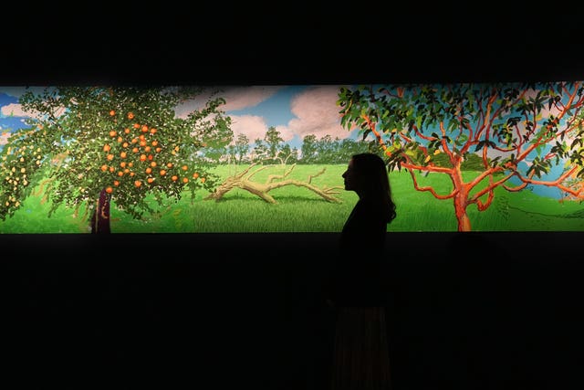 David Hockney painting at an exhibitionn