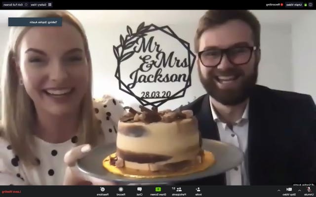 Ben Jackson and Sophie Austin celebrate with a cake