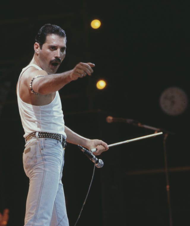 Freddie Mercury, of the pop band Queen, performing on stage during the Live Aid concert