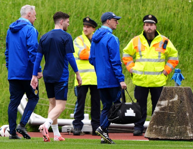 Andy Robertson, second left, walks off Scotland's training pitch in Germany as a precaution