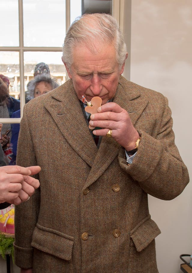Does it pass the sniff test, Charles gives his verdict on a bar of soap during his visit to Piece Hall (Arthur Edwards/The Sun/PA)
