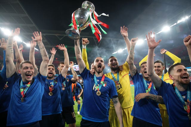 Italy's Leonardo Bonucci celebrates with the trophy after his side's victory