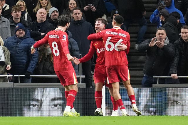 Liverpool’s Alexis Mac Allister (centre) celebrates scoring their second goal at Tottenham