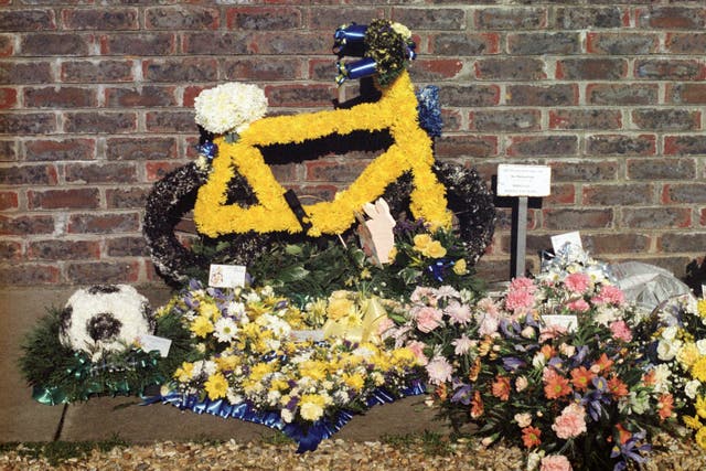 A floral tribute in the shape of a bicycle was left at Rikki's funeral