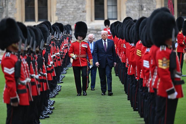 The King and US President Donald Trump review the Guard of Honour during the ceremonial welcome at Windsor Castle