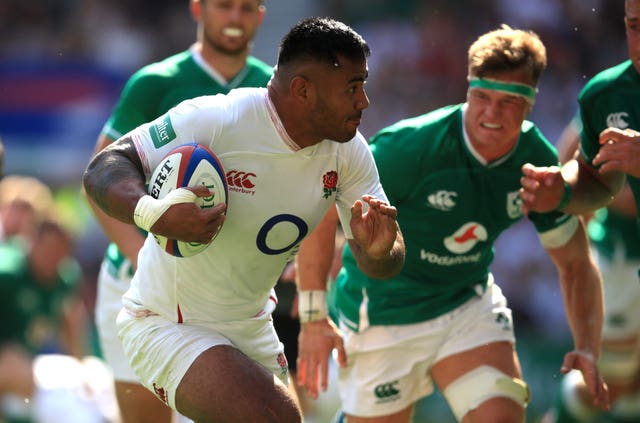 Manu Tuilagi, left, scores against Ireland