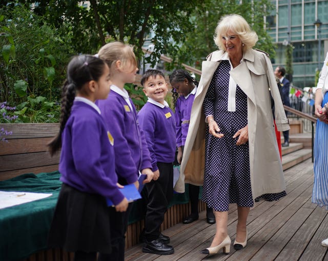 Queen Camilla, Patron of The Big Lunch, meets children from year two at the Mulberry Wood Wharf School, during a visit to a Big Lunch in Canary Wharf, east London,