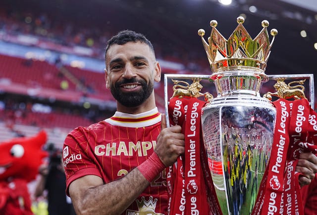 Salah holding the Premier League trophy
