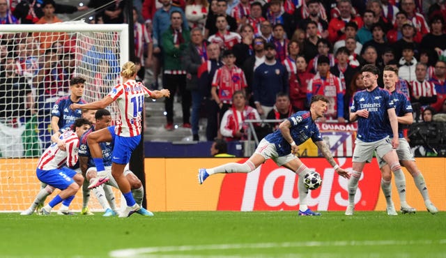 A shot from Atletico Madrid’s Marcos Llorente hits the hand of Arsenal’s Ben White resulting in a penalty