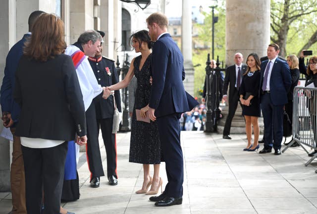 Prince Harry and Meghan Markle are greeted by clergy (Victoria Jones/PA)