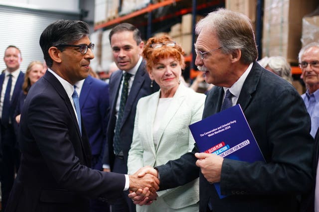 Rishi Sunak shakes hands with a man during the Welsh Conservatives manifesto launch