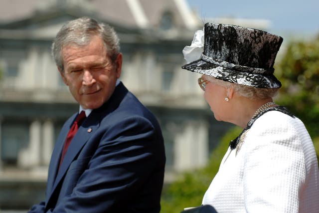 George Bush winks at the Queen on the lawn of the White House