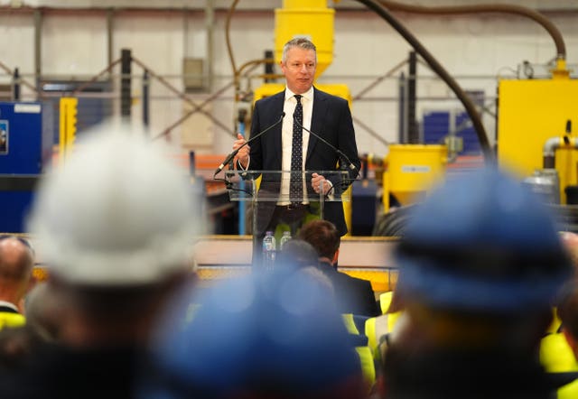 Luke Pollard speaking in front of men in hard hats