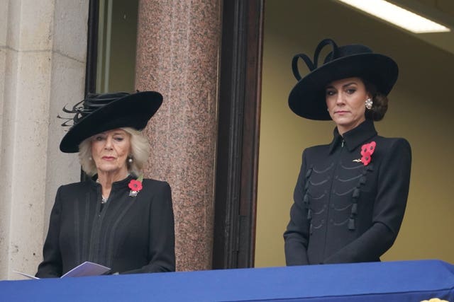 The Queen and the Princess of Wales watch proceedings from a balcony