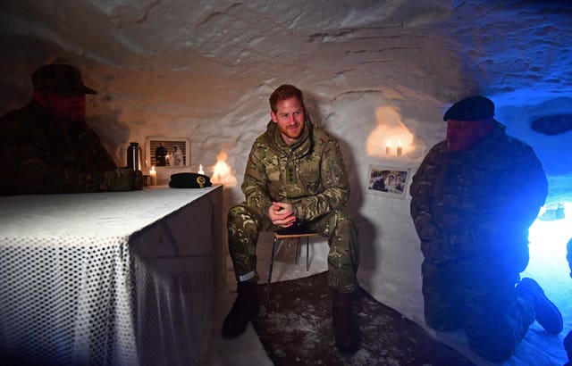 Harry sits inside a Quincey Shelter in Norway