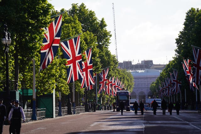 The Mall cleared ahead of the Trooping the Colour procession, with Union flags hanging from flag poles