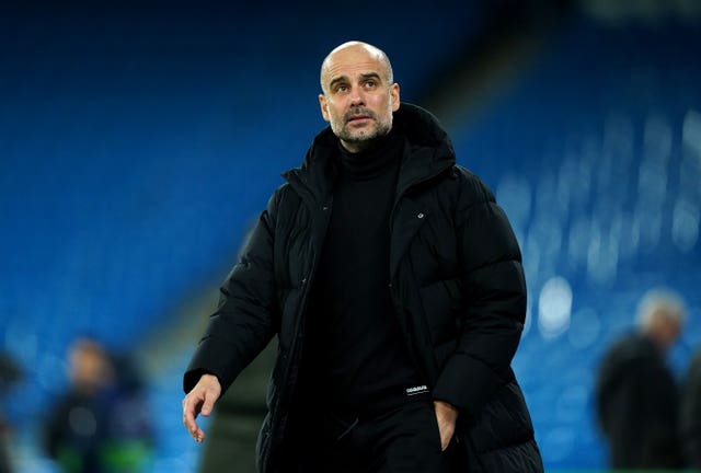 Pep Guardiola tries to play down talk of Manchester City winning the treble