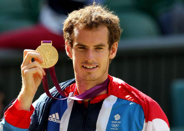 Andy Murray holds his gold medal