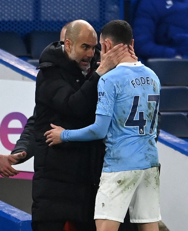 Guardiola (left) continues to be impressed by the development of Phil Foden (right)