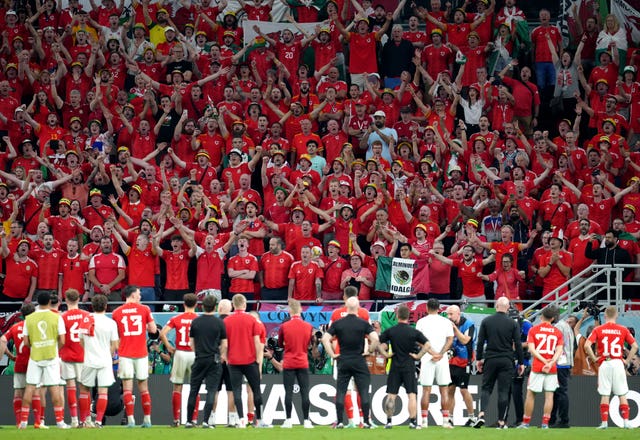 The Wales players applaud their supporters after defeat to England