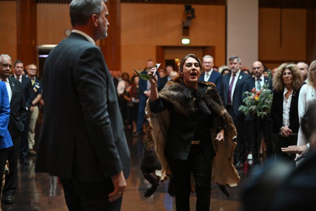 Australian senator Lidia Thorpe protests during the ceremonial welcome in Canberra for the King and Queen 