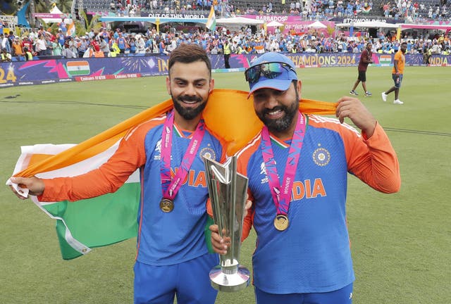 Virat Kohli and Rohit Sharma celebrate with the T20 World Cup trophy