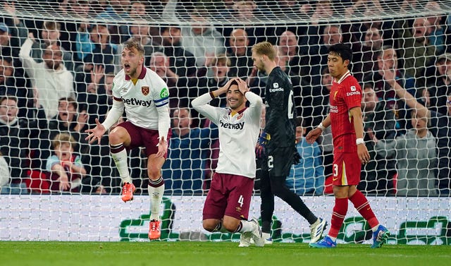 Jarrod Bowen and Carlos Soler show their disbelief after West Ham are denied a penalty at Anfield