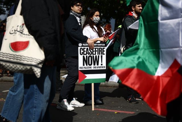 People take part in a pro-Palestine march in central London organised by the Palestine Solidarity Campaign