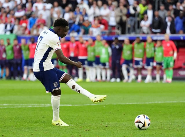 England’s Bukayo Saka scores his penalty during the Euro 2024 shoot-out victory over Switzerland