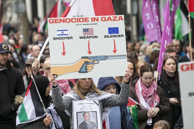 People march between the Garden of Remembrance and the Dail in Dublin